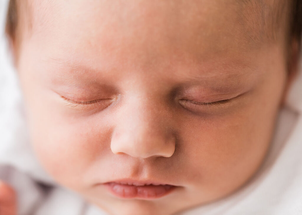 Macro close up image of newborn babies eyelashes. Image taken during newborn baby photoshoot.