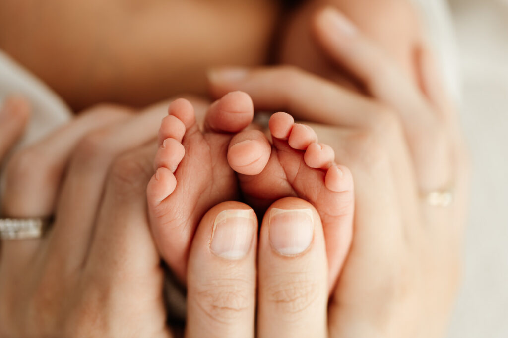 Close up macro image of newborn babies toes taken during newborn photoshoot.